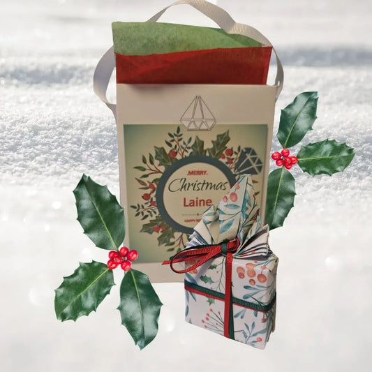 Christmas gift card on ojewellery gift bag with Christmas wrap present