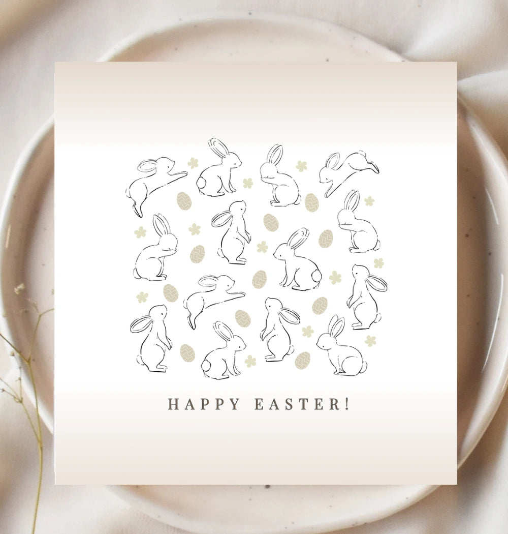 Gift card with bunnies easter eggs and flowers on it in neutral colours