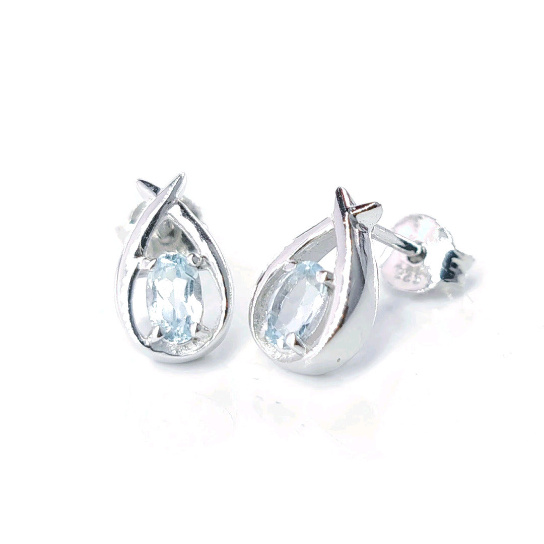 Topaz Earrings 0.5ct Pear Blue Twist Studs Silver December Birthstone