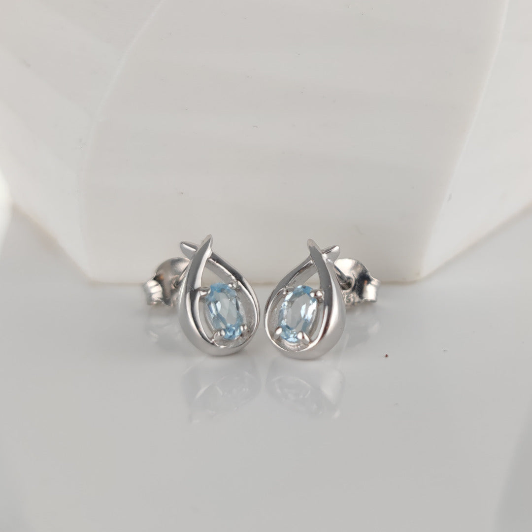 Topaz Earrings 0.5ct Pear Blue Twist Studs Silver December Birthstone