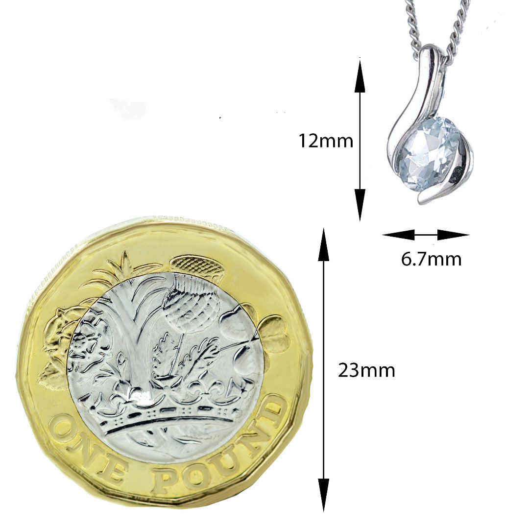 Aquamarine oval pendant sterling silver dimensioned shown to scale alongside pound coin