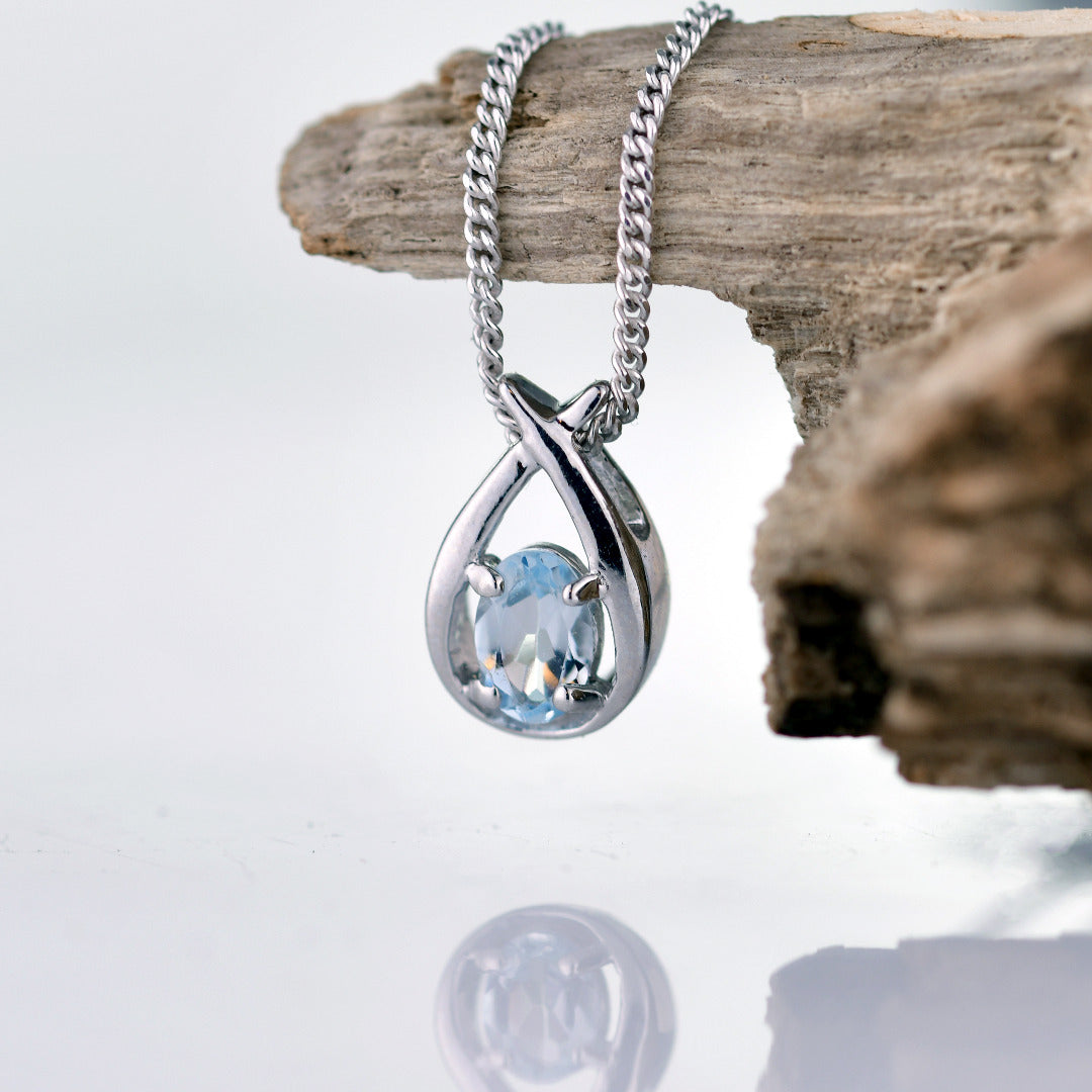 Aquamarine Oval pendant sterling silver on branch