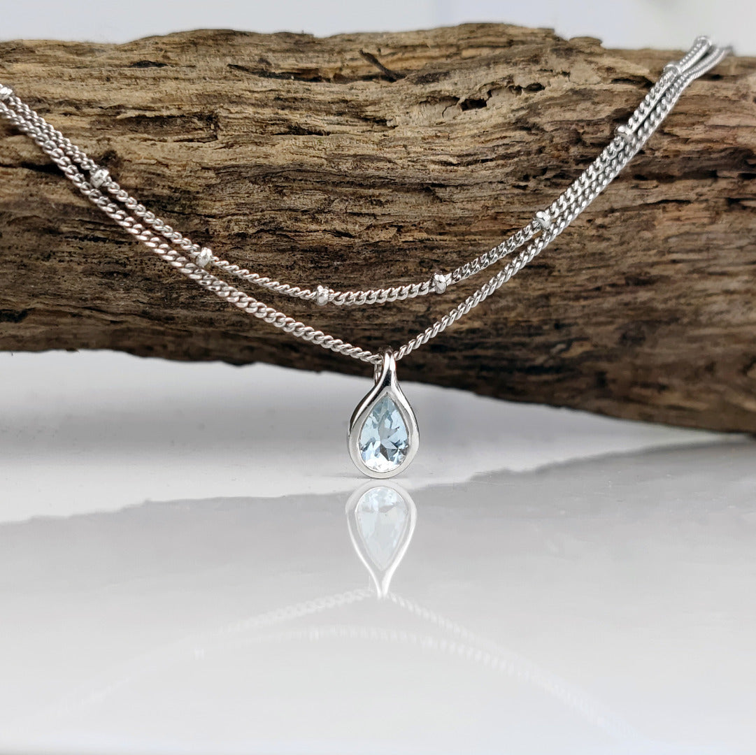 Aquamarine rubover pear pendant plus layered bead chain sterling silver branch